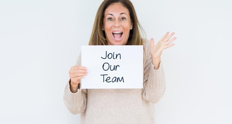 Woman holding join our team sign