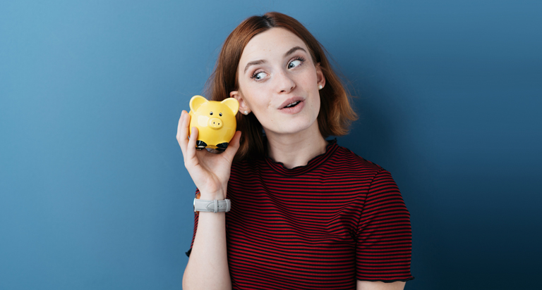 Woman holding piggy bank