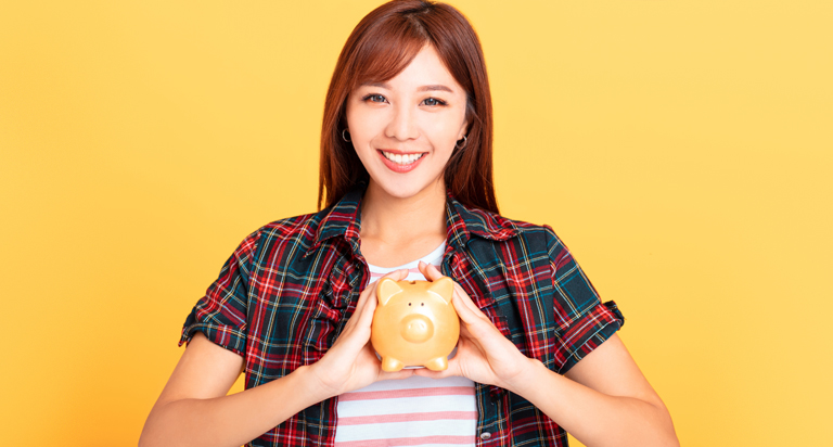 Woman holding piggy bank