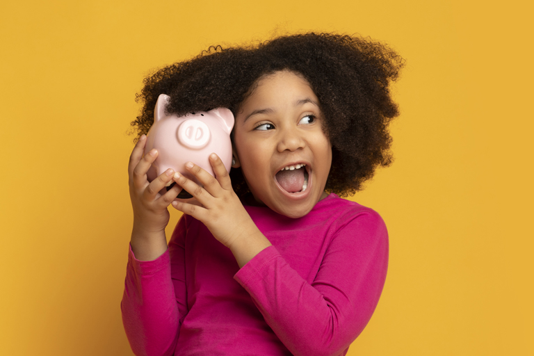 Child holding piggy bank