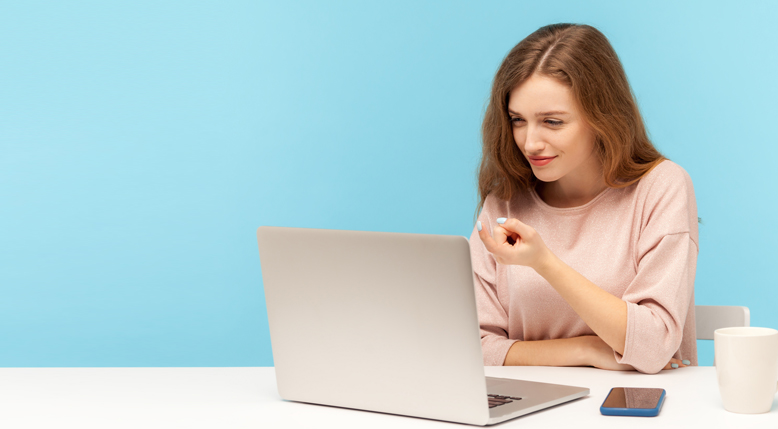 Woman looking at laptop